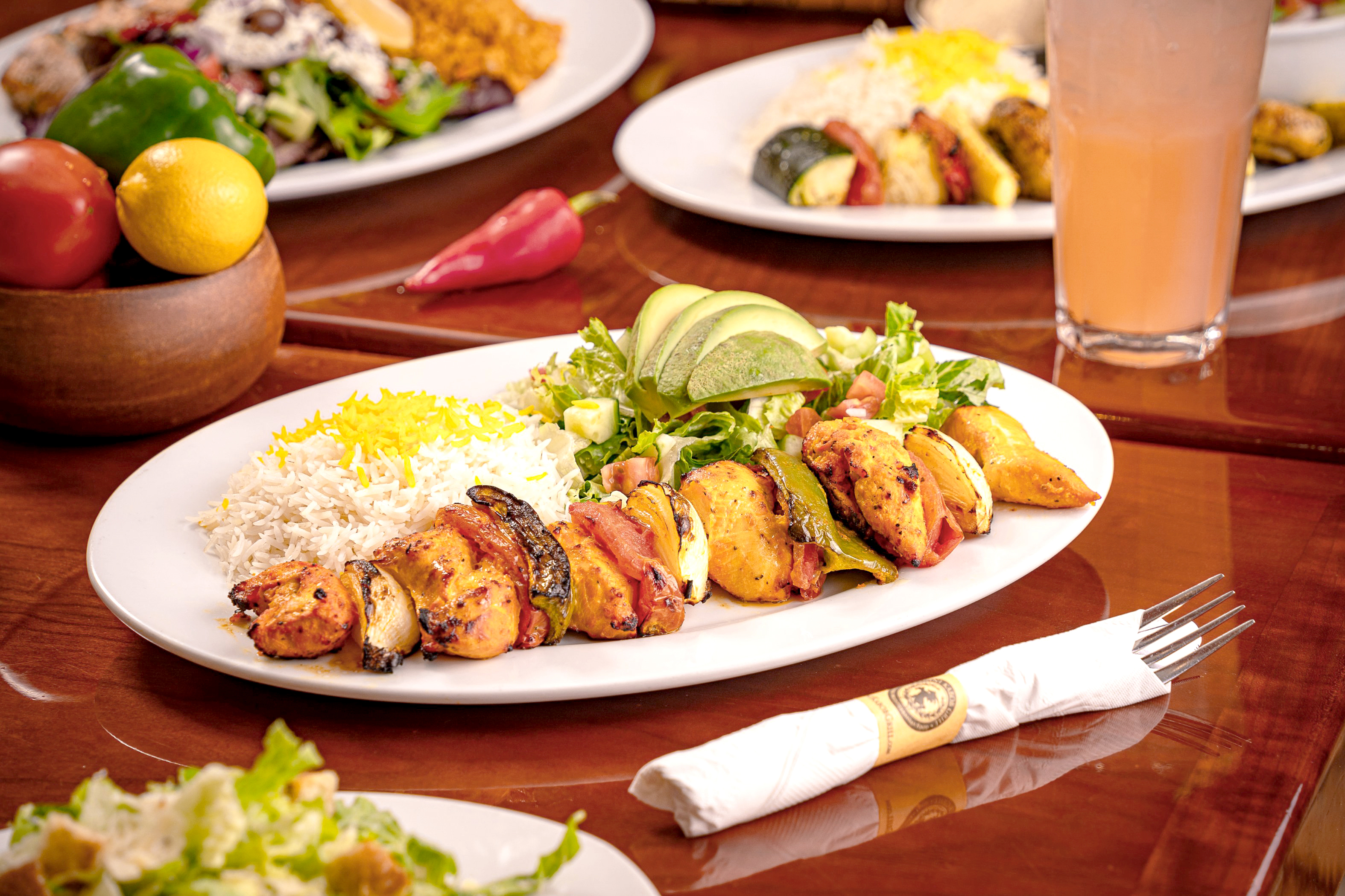 Panini Kabob Grill at Hollywood Park signature Mediterranean grilled chicken kabob plate with basmati rice and green salad